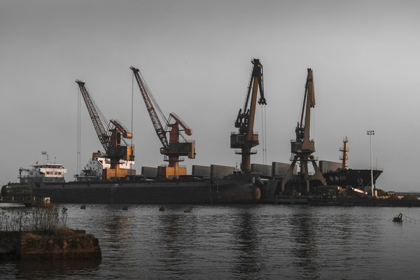 How to ensure compliance with UK and international maritime laws for a shipbuilding company?